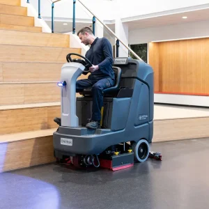 stand-on-ride-on-scrubber-dryers-man-cleaning-gym