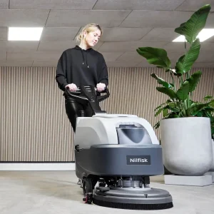 walk-behind-scrubber-dryers-woman-cleaning-meeting-room